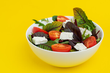 Bowl of fresh salad with tomatoes. Italian salad