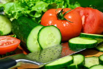 knife with sliced cucumber