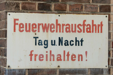 Old sign with the German inscription Keep fire station clear day and night