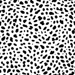 Seamless animal pattern. Imitation of skin of dalmatian dog. Black spots on white background.