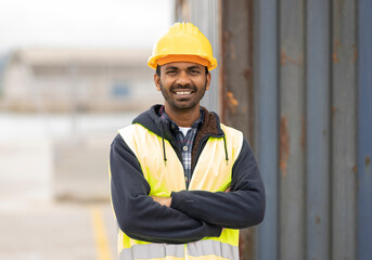 indian engineer man working in logistics at container port - migrant worker man concept - - obrazy, fototapety, plakaty