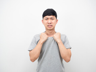 Asian man gesture pull shirt feeling weather it hot white background