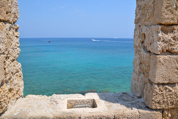 mediterranean sea through the window of ancient fortress