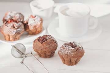 comfort food, cozy breakfast with coffee and berry muffins. home baked pastry