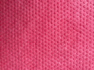 pink textured surface with uneven shading