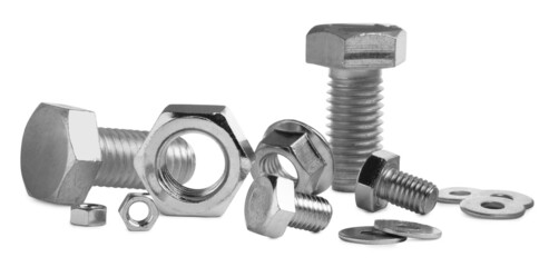 Different metal bolts and nuts on white background