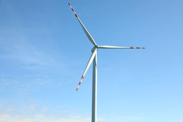 Modern wind turbine against blue sky. Alternative energy source