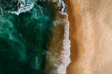 Top down aerial of deserted beach in Portugal captured from a drone