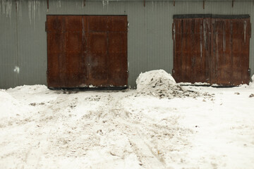 Garage door in winter. Entrance to warehouse. Production room.