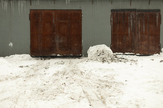 Garage door in winter. Entrance to warehouse. Production room.