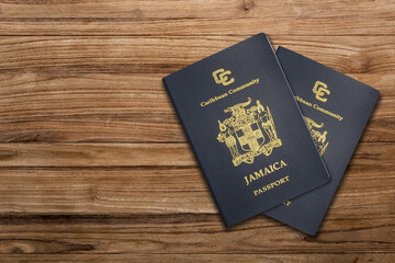 Jamaican passport on a wooden background ,The Jamaican passport is issued to citizens of Jamaica for international travel.