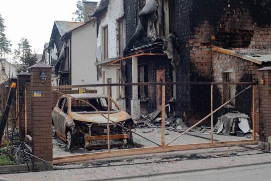 War of Russia against Ukraine. Burnt house and car in Bucha