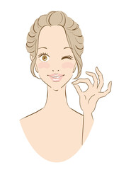 ウインクしたきれいな女性のオッケーサイン
