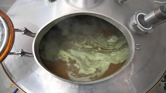 Brew tank with boiling malt. High quality 4k footage
