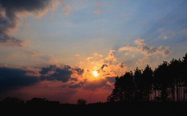 Fototapeta premium Beautiful horizontal sunset on a slightly overcast sky