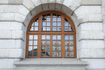 View of beautiful arched window in building outdoors