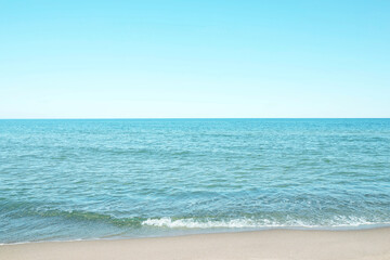Fototapeta na wymiar Beautiful view of sea shore and blue sky on sunny day