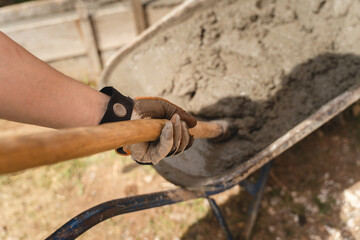 A man is building wall with cement