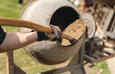 A man is building wall with cement