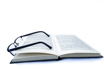 Pair of Glasses on Book