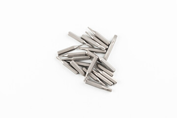 Isolated on a white background tips of a group of phillips head screwdriver bits. Top view.
