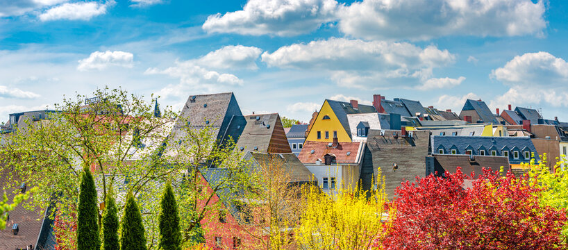 Panoramic view over historical downtown of a small town Mittweida, with old buildings, traditional roofs, at Spring colors, at sunny day and blue sky, Saxony, Germany.