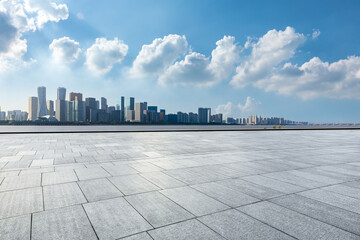 Empty square floor and city skyline with modern commercial buildings in Hangzhou, China.