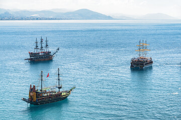 Naklejka na ściany i meble Aerial view of tourist ships in the Mediterranean Sea, Alanya