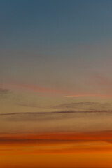 Cover page with gradient soft deep orange sky, illuminated clouds at bloody sunset as a background.