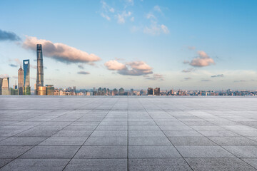 Empty square floor and city skyline with buildings in Shanghai at sunset, China.