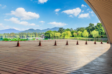 Wooden square and beautiful natural scenery in West Lake, Hangzhou, China.