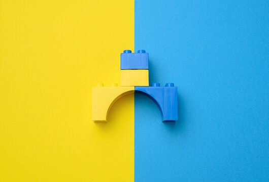 Plastic yellow-blue details of the children's designer. Children's educational game, top view