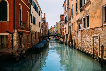 Obraz na płótnie Canvas Traditional narrow canal street with old houses in Venice, Italy. Italy beauty, one of canal streets in Venice, Venezia