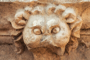 Ancient lion head relief sculpture in the Side Ancient City, Turkey. Ruins of the ancient city....
