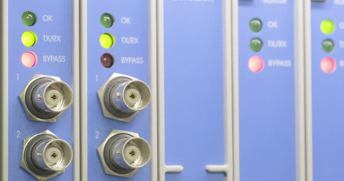 linking LEDs on optical converters showing big traffic, technology background, internet service provider data transfer monitoring