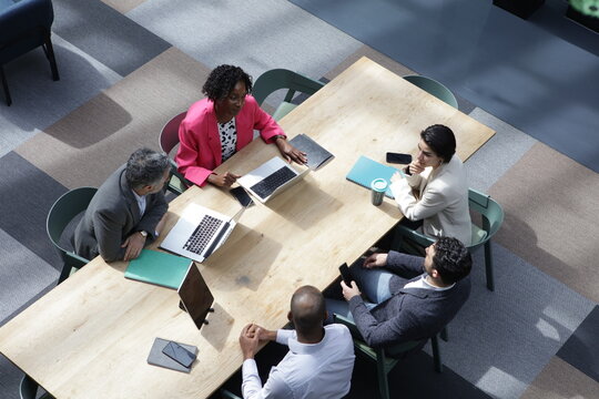 High Angle View Of Business People Having Business Meeting