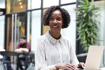 Businesswoman working on laptop in office