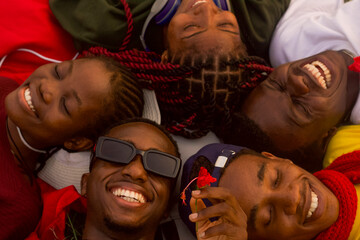 Group of young friends lying on back