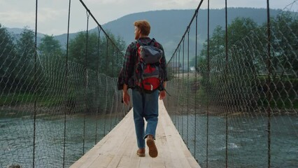 Man traveling mountain nature. Hiker walking enjoying picturesque landscape view