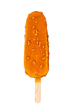 Ice cream on a stick in caramel glaze with nuts