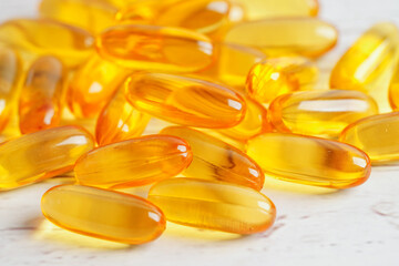 Fish oil or Cod liver oil gel in capsules with omega 3 vitamins, supplementary healthy food
