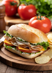 Turkey sandwich with lettuce cheese and tomato