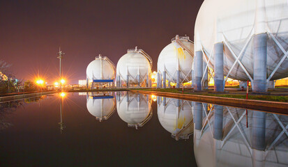 Natural gas tank at night - LNG or liquefied natural Industrial Spherical gas storage tank