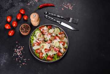 Delicious spring fresh vegetable salad with cherry tomatoes, cucumber, breadcrumbs and parmesan cheese