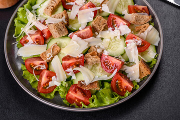 Delicious spring fresh vegetable salad with cherry tomatoes, cucumber, breadcrumbs and parmesan cheese