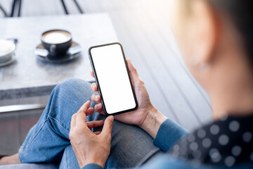 cell phone blank white screen mockup.hand holding texting using mobile on desk at office.background empty space for advertise.work people contact marketing business,technology