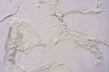 Moisture on the wall causing the color of the wall to bulge and cause mold.