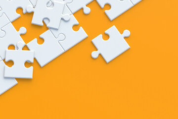 Unfinished blank jigsaw puzzle pieces on orange background. Copy space. Top view. 3d render