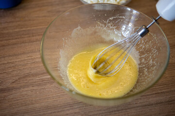 mixing eggs in bowl close up