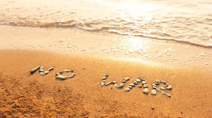 Words written in the sand on the beach. The words No War and written in the Sand with the Ocean in the background. Protest War sign written in sand. World Peace. No War